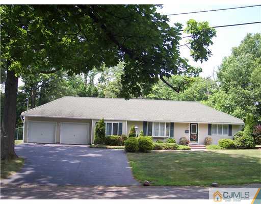 5 Maida Road Edison, NJ 08820 - Photo 1 of 23 a front view of a house with a garden and porch