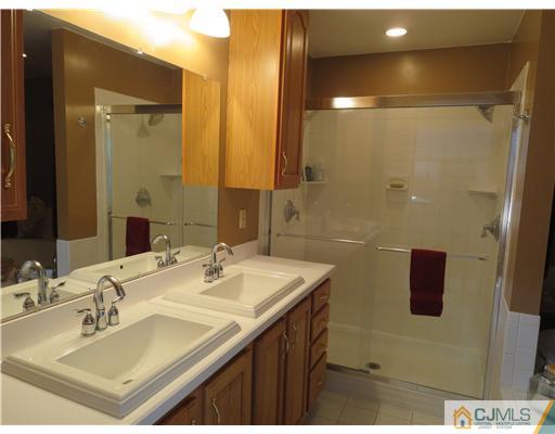 5 Maida Road Edison, NJ 08820 - Photo 11 of 23 a bathroom with a sink vanity and mirror