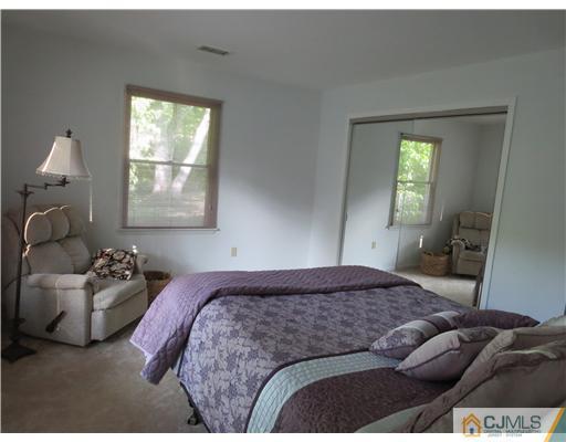 5 Maida Road Edison, NJ 08820 - Photo 12 of 23 a bedroom with a bed and window