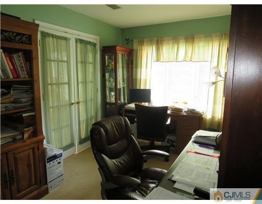 5 Maida Road Edison, NJ 08820 - Photo 14 of 23 a living room with furniture fireplace and a flat screen tv
