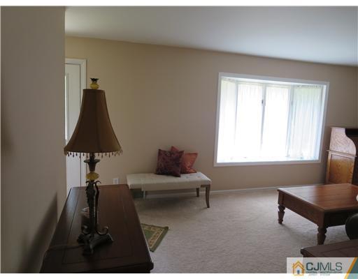 5 Maida Road Edison, NJ 08820 - Photo 21 of 23 a living room with furniture and a window