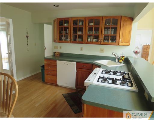 5 Maida Road Edison, NJ 08820 - Photo 7 of 23 a kitchen with stainless steel appliances granite countertop a stove and a sink