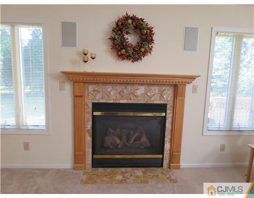 5 Maida Road Edison, NJ 08820 - Photo 9 of 23 a living room with a fireplace