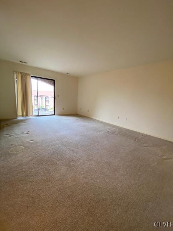 916 Cold Spring Road, Unit 12 Allentown, PA 18103 - Photo 11 of 24 Living room with sliding doors