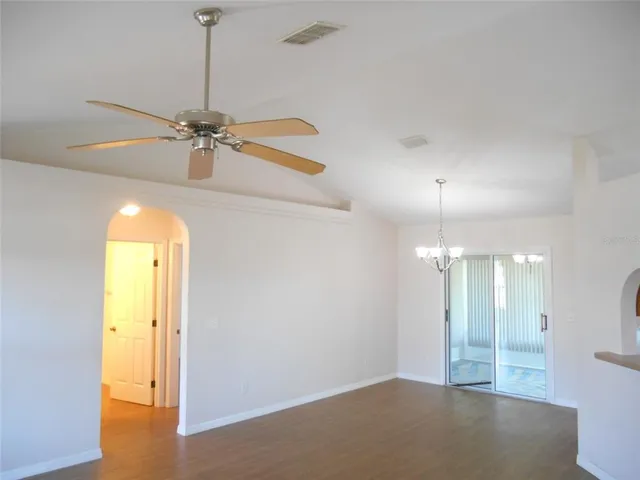 a view of a room with a ceiling fan