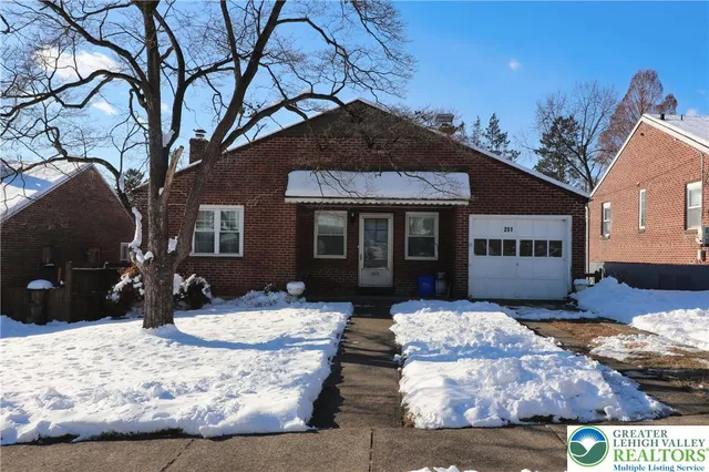 a view of a house with a snow in the yard