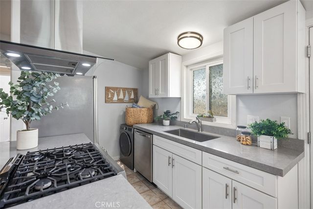 a view of a dining room with furniture and a large window