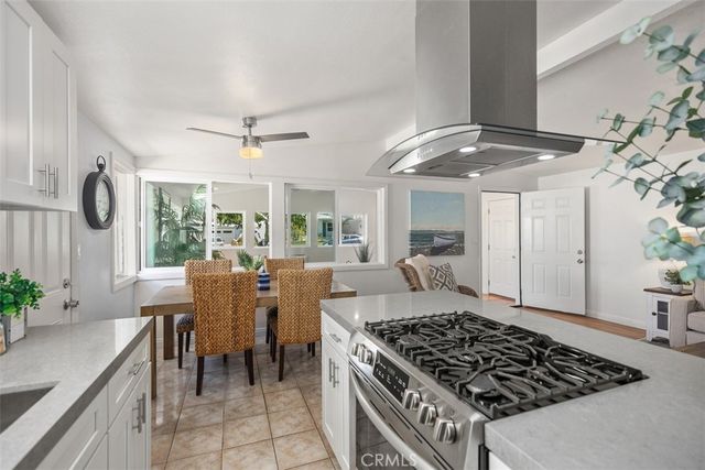 a kitchen with sink and stove