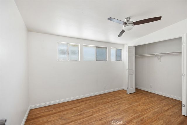 a kitchen with stainless steel appliances granite countertop a stove a sink and a dining table