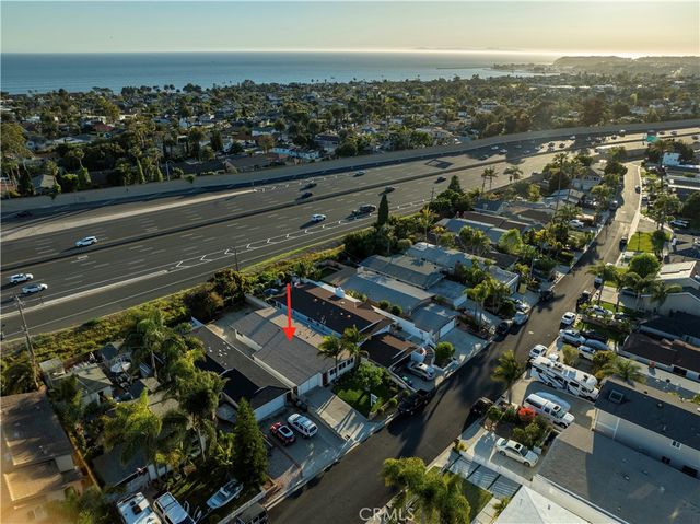 a bedroom that has a bed and a chair in it