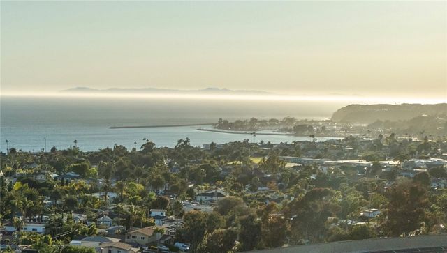 a view of a patio with couches and a fire pit