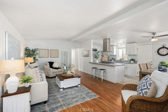 a living room with furniture or outdoor view and kitchen view