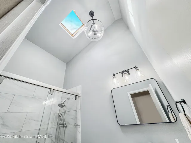 a view of a chandelier fan in a room