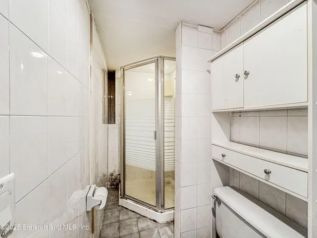 a front view of a residential apartment building with yard