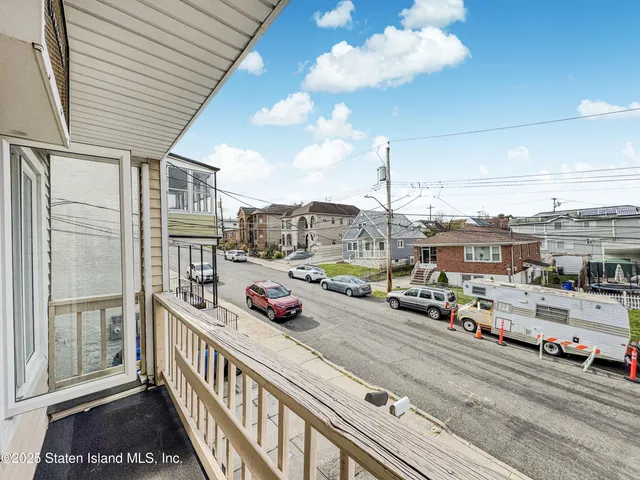 a view of a balcony with city view