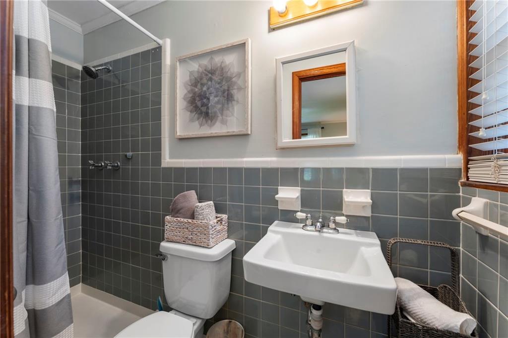5122 Lavista Road Tucker, GA 30084 - Photo 12 of 24 a bathroom with a sink mirror and toilet