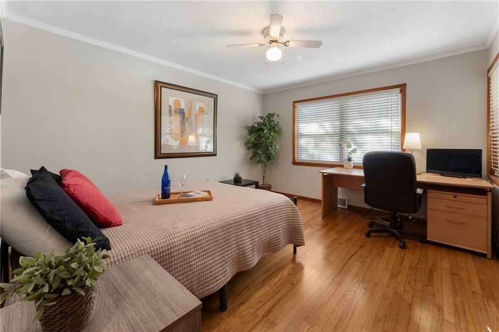 5122 Lavista Road Tucker, GA 30084 - Photo 13 of 24 a bedroom with a bed and a chair