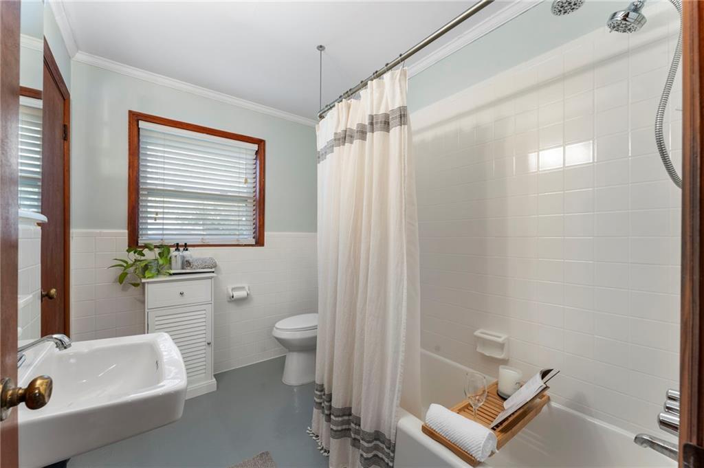 5122 Lavista Road Tucker, GA 30084 - Photo 15 of 24 a bathroom with a sink a toilet and shower