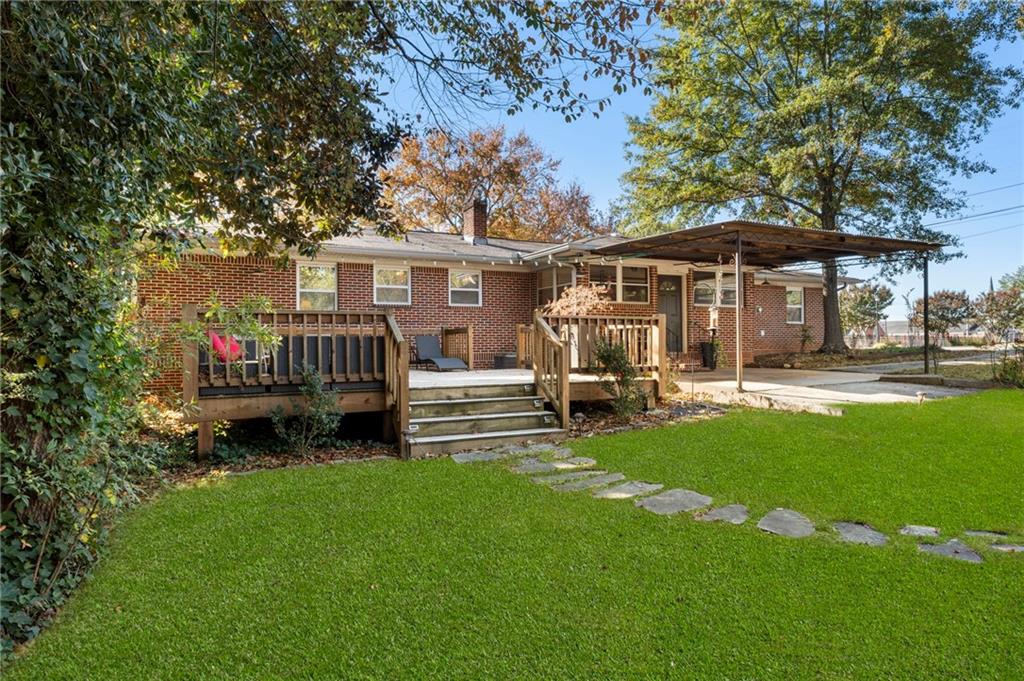 5122 Lavista Road Tucker, GA 30084 - Photo 23 of 24 a front view of a house with garden