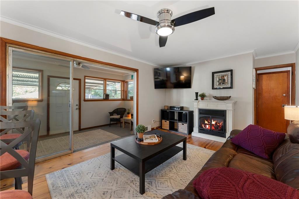 5122 Lavista Road Tucker, GA 30084 - Photo 3 of 24 a living room with furniture and a fireplace