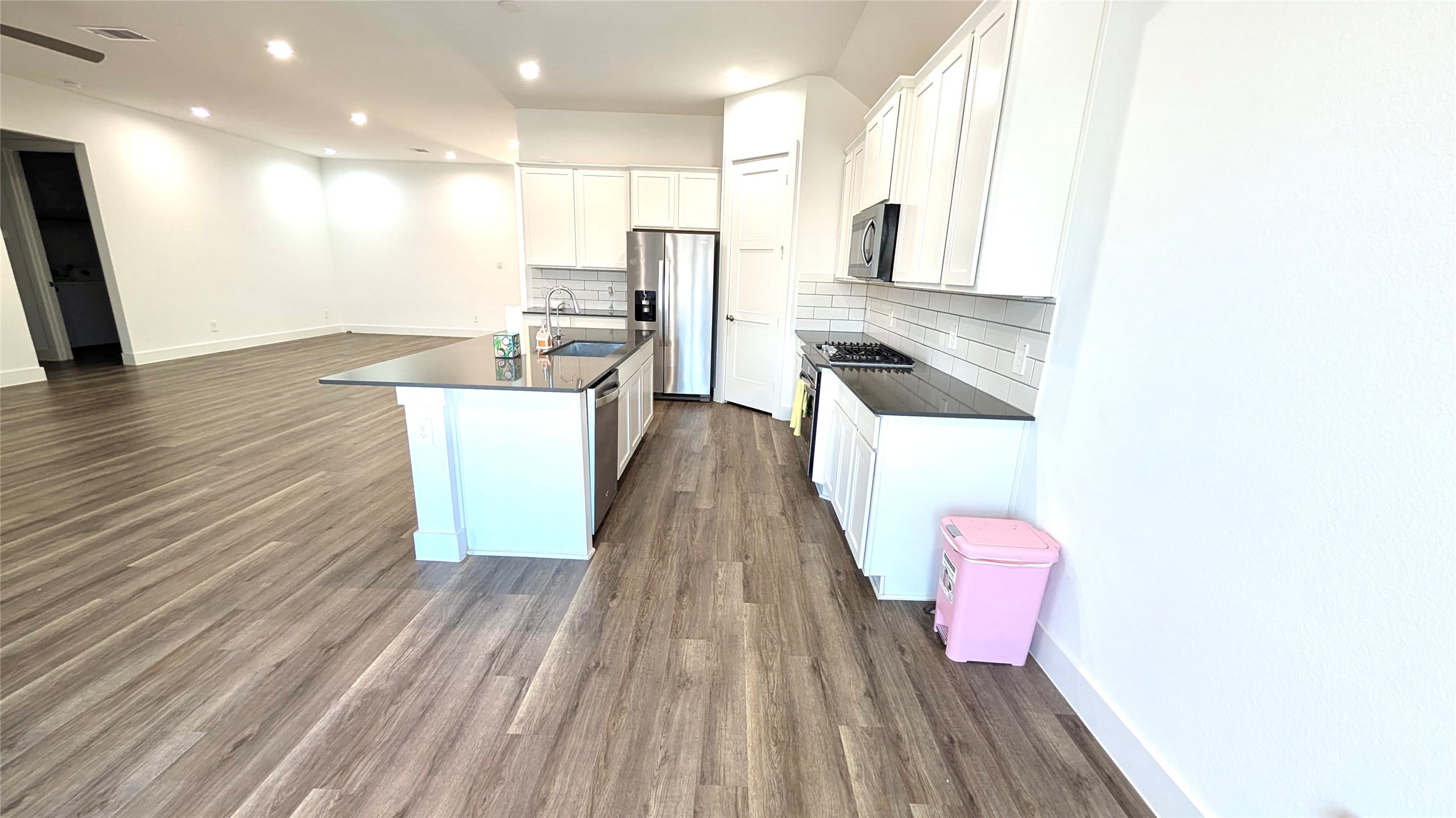 13760 Rising Sun Lane Conroe, TX 77384 - Photo 21 of 43 a kitchen with stainless steel appliances a refrigerator and a stove top oven