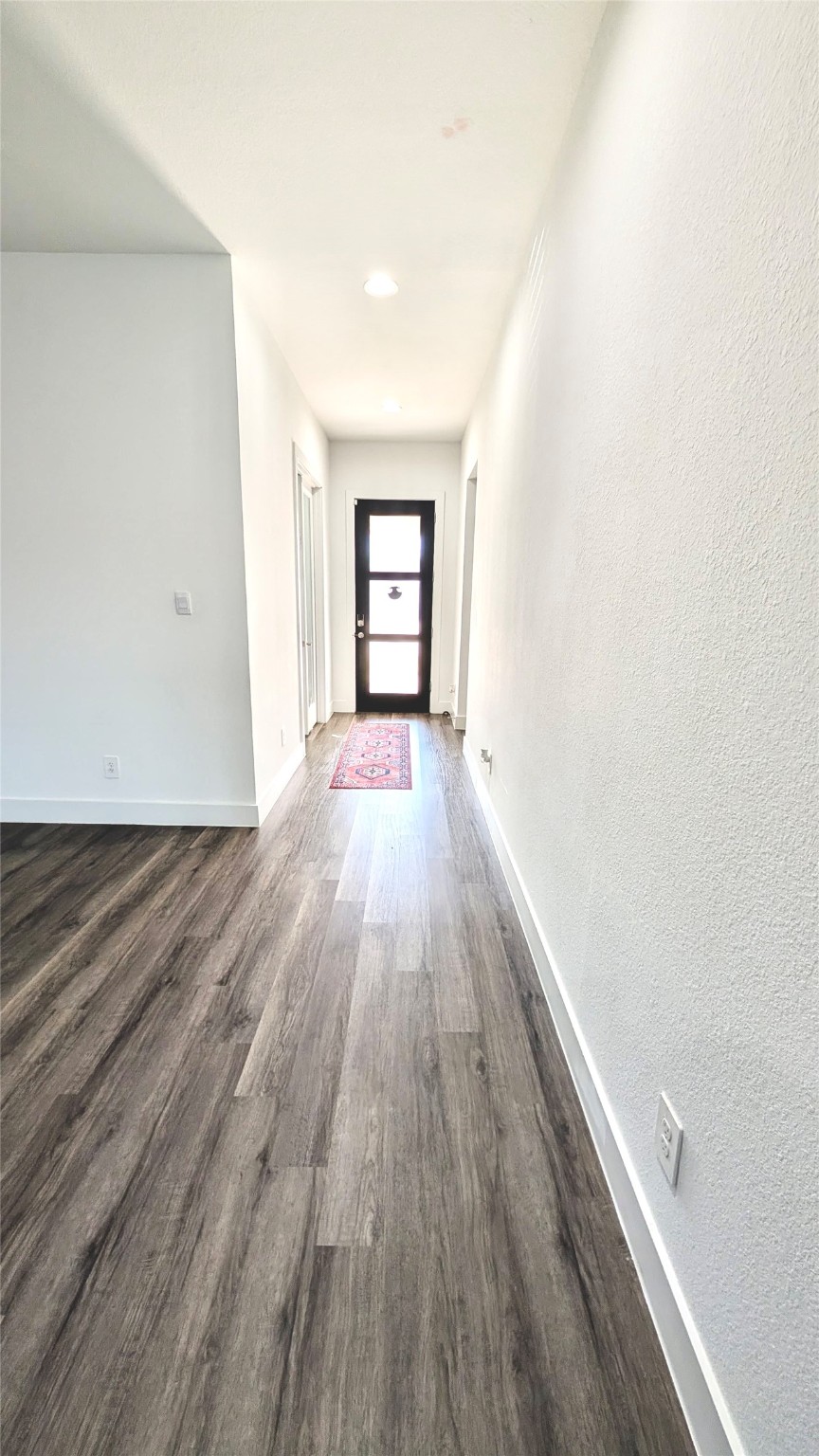13760 Rising Sun Lane Conroe, TX 77384 - Photo 23 of 43 an empty room with wooden floor and windows