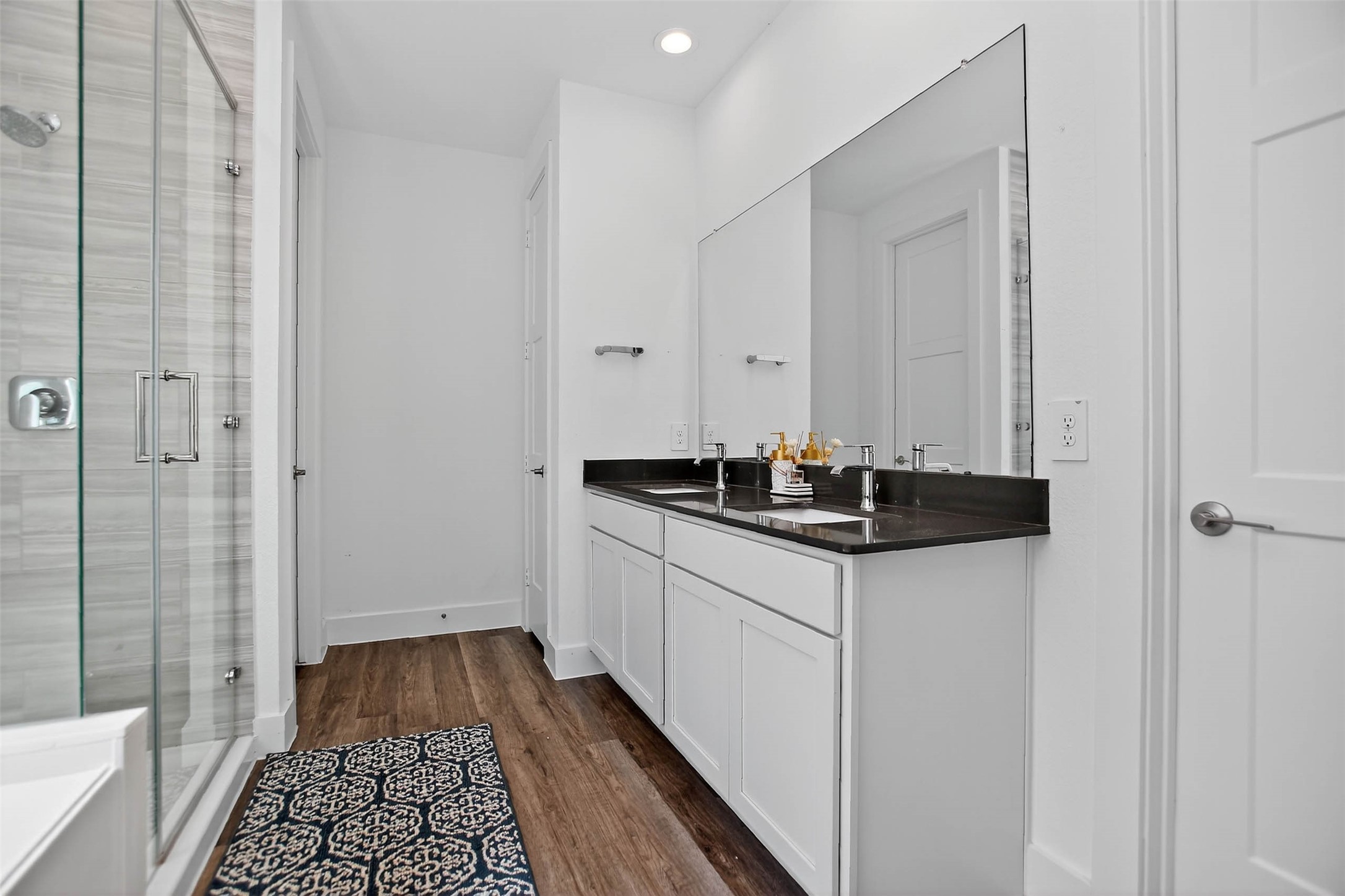 13760 Rising Sun Lane Conroe, TX 77384 - Photo 31 of 43 a bathroom with a sink and a mirror