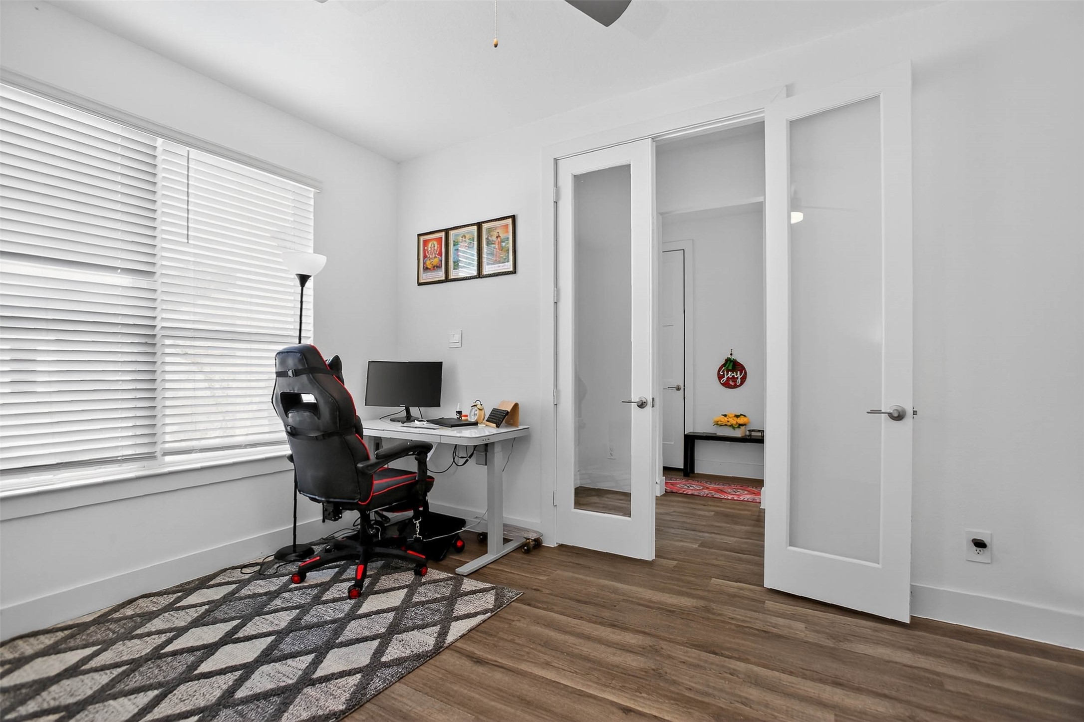 13760 Rising Sun Lane Conroe, TX 77384 - Photo 34 of 43 a workspace with wooden floor and a window