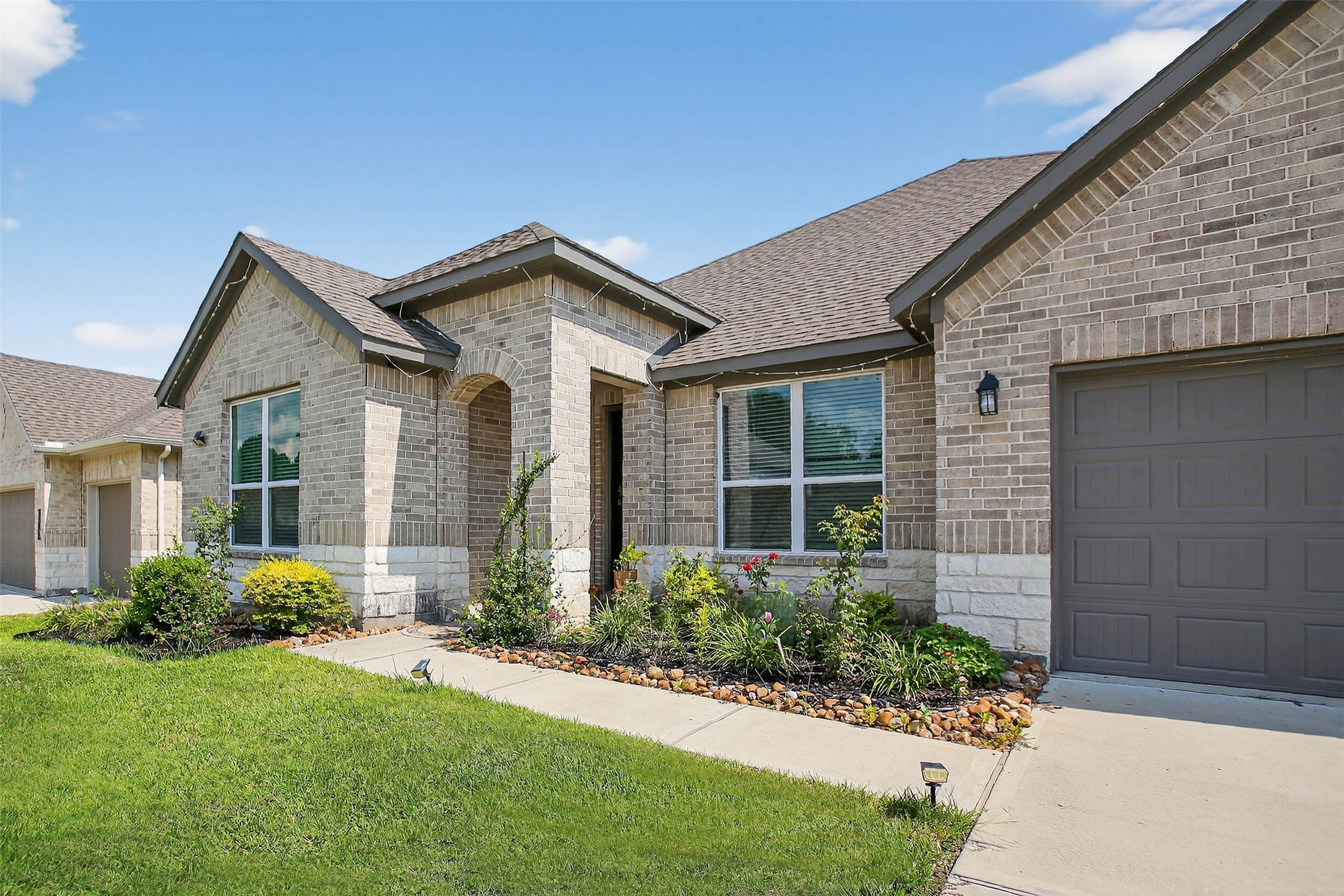 13760 Rising Sun Lane Conroe, TX 77384 - Photo 4 of 43 a front view of a house with a yard