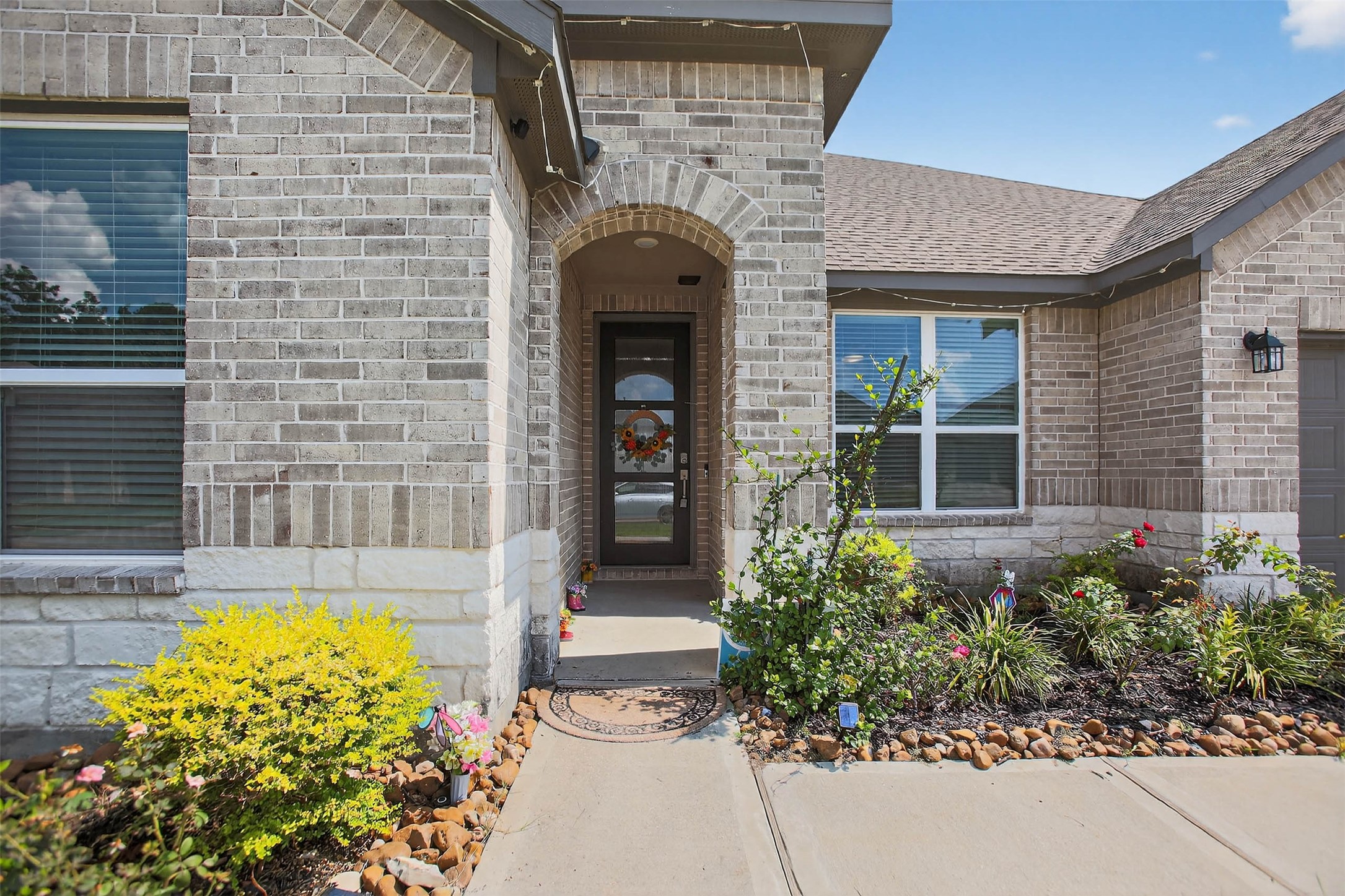 13760 Rising Sun Lane Conroe, TX 77384 - Photo 5 of 43 a front view of a house with a garden