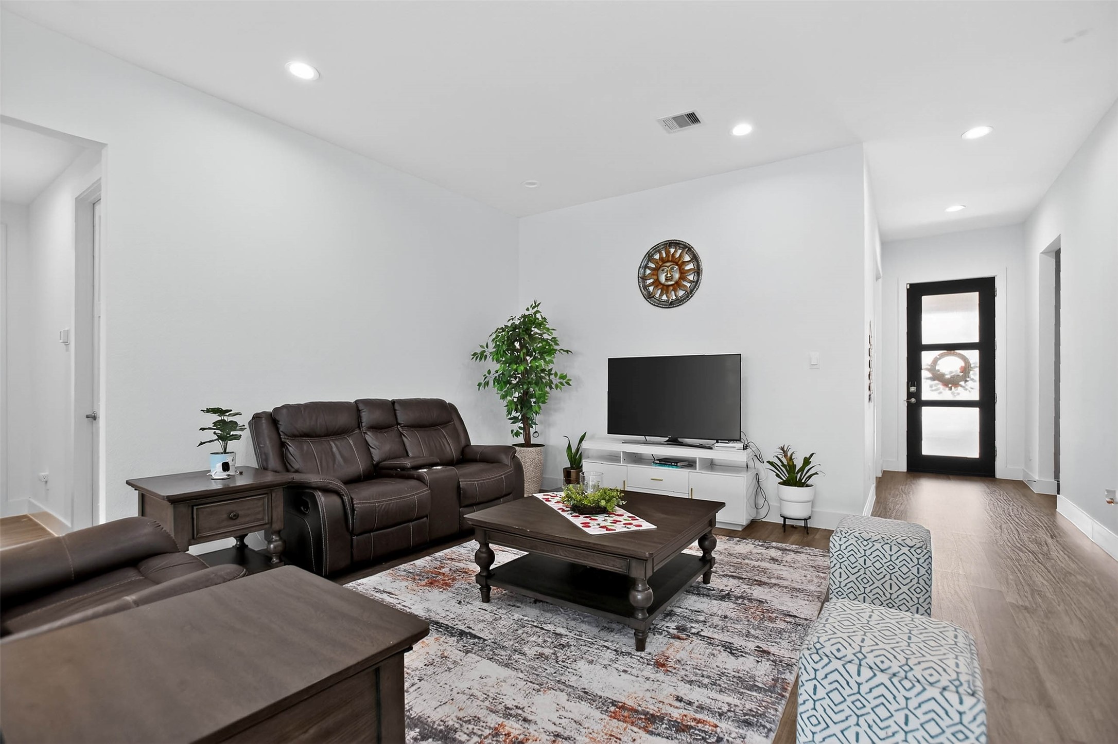 13760 Rising Sun Lane Conroe, TX 77384 - Photo 8 of 43 a living room with furniture and a flat screen tv
