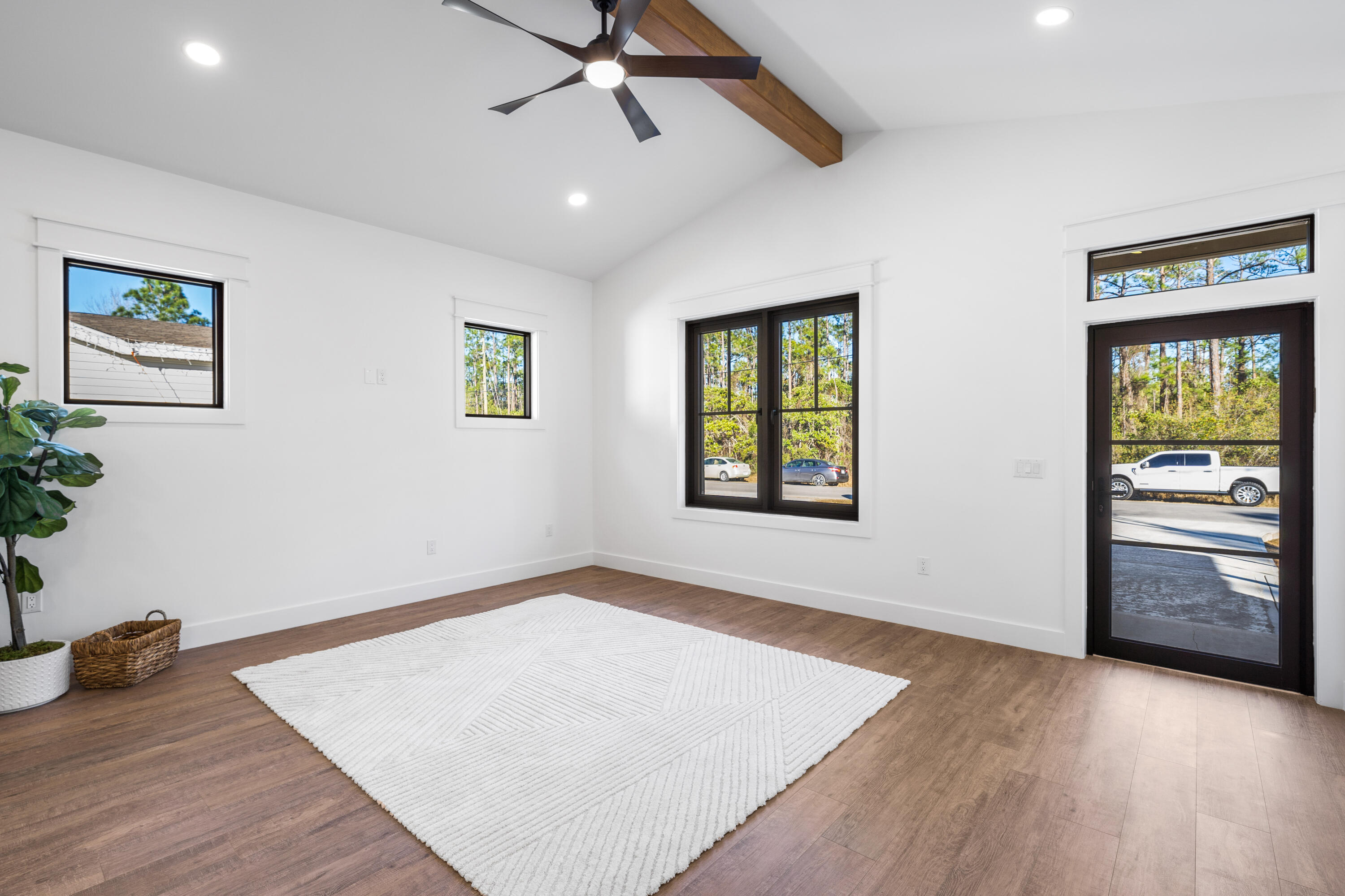 783 Indian Woman Road Santa Rosa Beach, FL 32459 - Photo 15 of 33 wooden floor in an empty room with a window