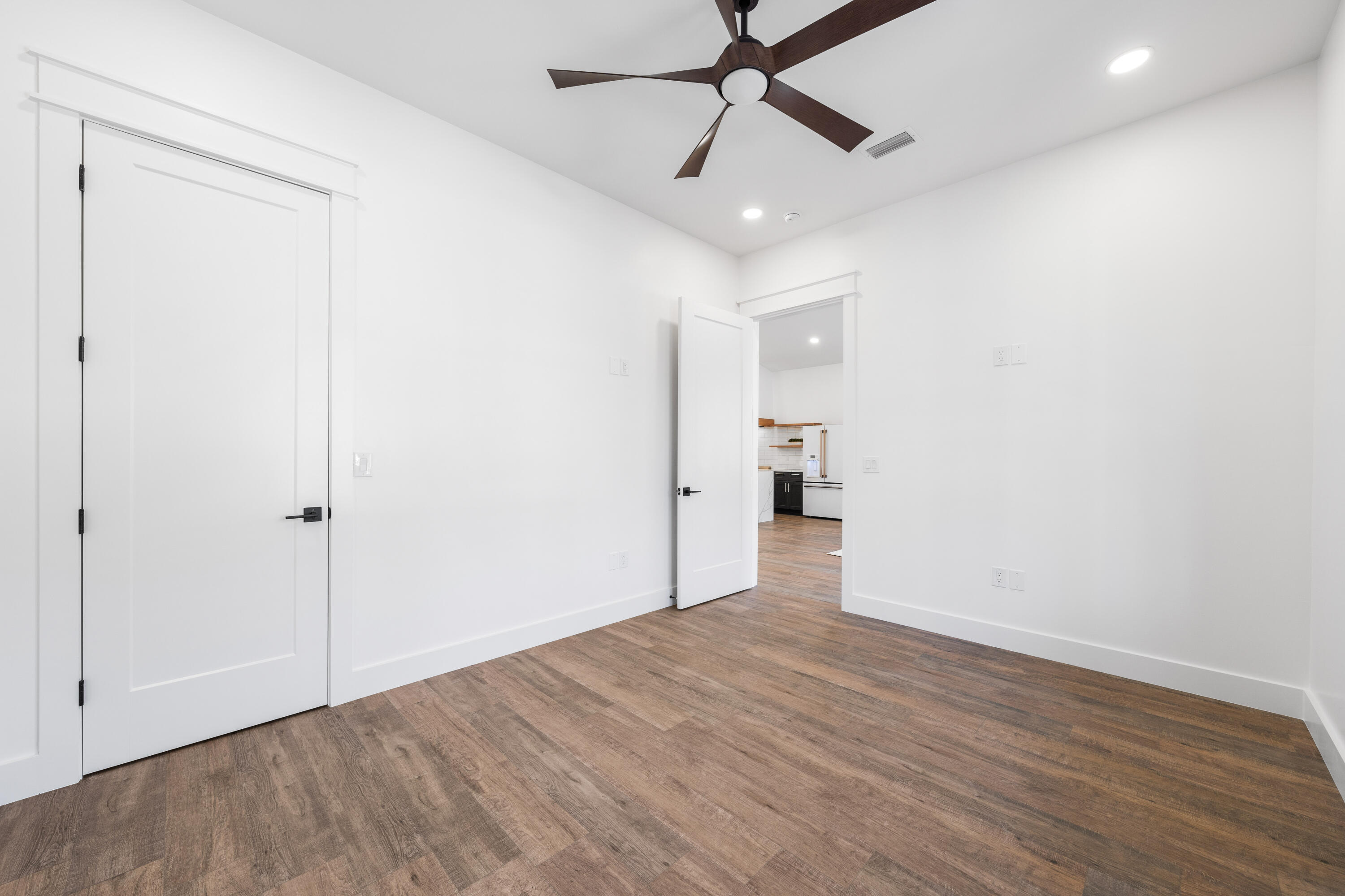 783 Indian Woman Road Santa Rosa Beach, FL 32459 - Photo 27 of 33 wooden floor in an empty room with a window