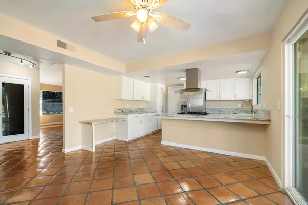 a view of a kitchen with a sink and a window