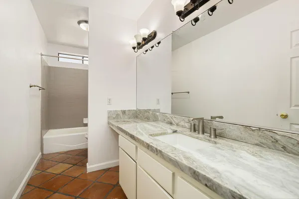 a bathroom with a white bath tub