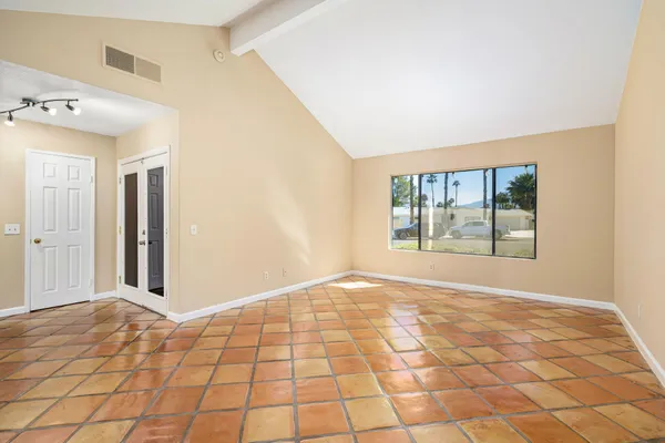 a view of an empty room and window
