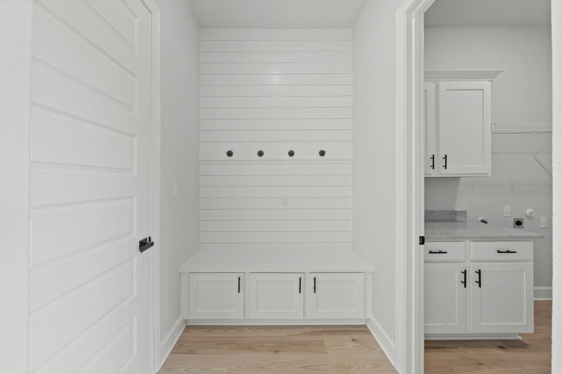 17109 Howdy Way Manor, TX 78653 - Photo 10 of 24 Mudroom and laundry room are conveniently adjacent as you enter from the garage.