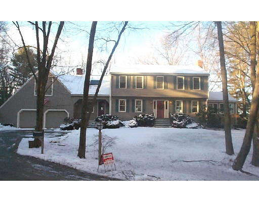 a view of a house with backyard porch and sitting area
