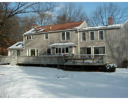 302 Flagg Hill Road Boxborough, MA 01719 - Photo 2 of 4 a front view of a house with a yard