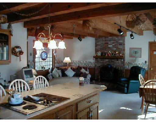 302 Flagg Hill Road Boxborough, MA 01719 - Photo 3 of 4 a kitchen with a stove and a dining table