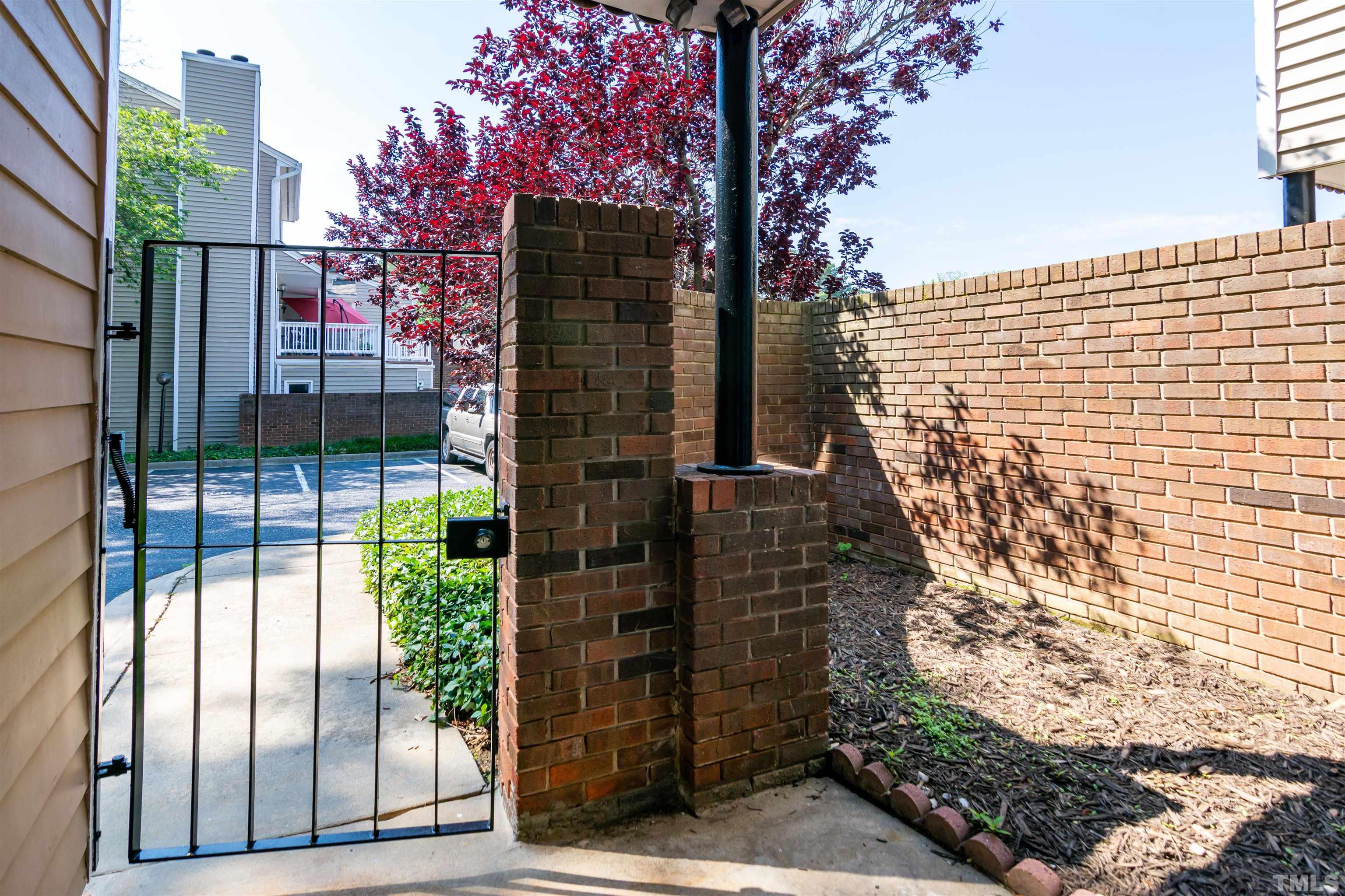 7050 Sandy Forks Road, Unit 103 Raleigh, NC 27615 - Photo 3 of 33 a view of a pathway of a building