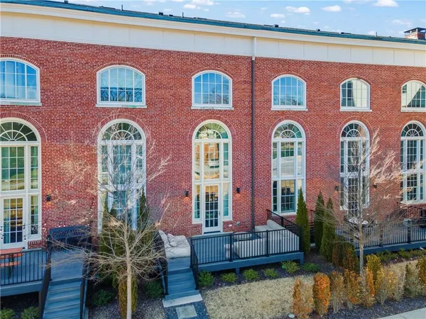 a front view of a brick building with many windows