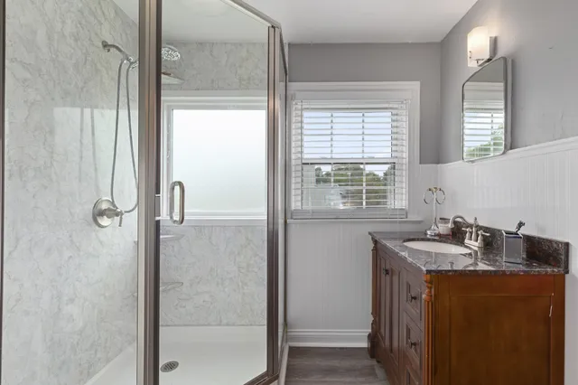 a bathroom with a sink and a mirror