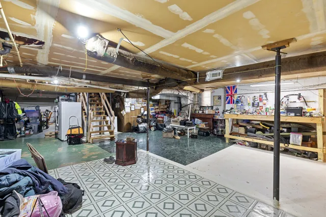 a view of a storage room with a table and chairs