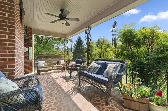 a outdoor living space with furniture and a potted plant