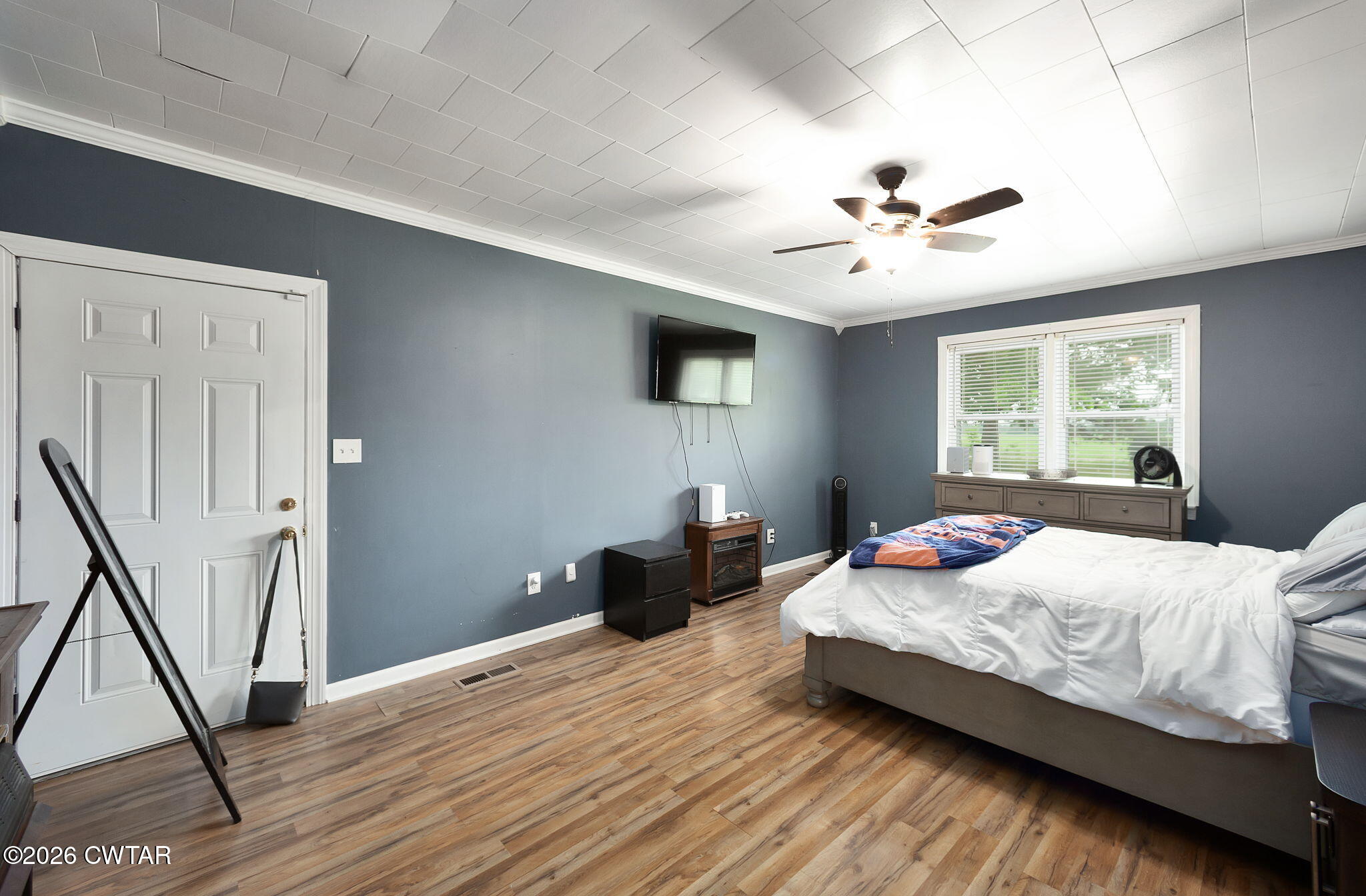 1921 Nance Road Alamo, TN 38001 - Photo 22 of 29 a bedroom with a bed and a chandelier