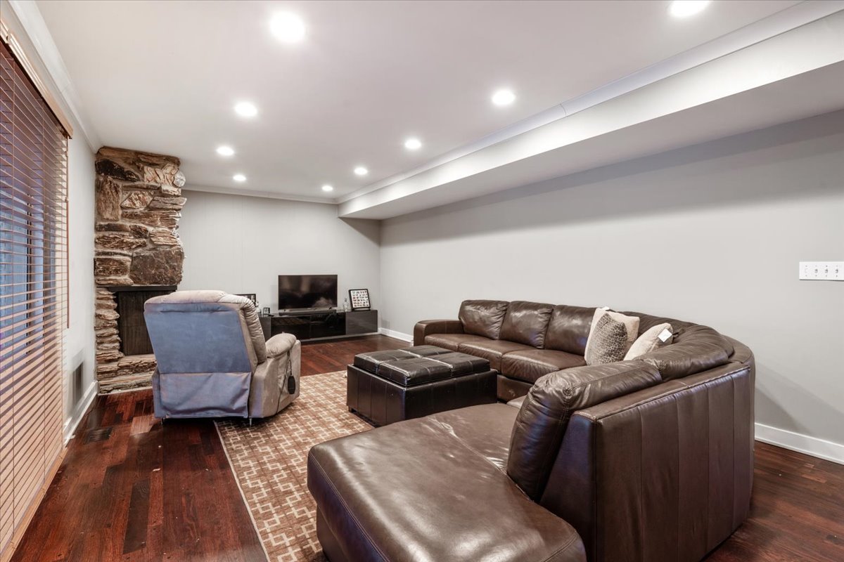 1908 McCraren Road Highland Park, IL 60035 - Photo 15 of 37 a living room with furniture and a flat screen tv