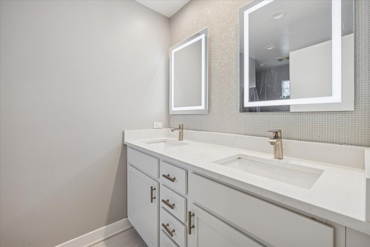 1908 McCraren Road Highland Park, IL 60035 - Photo 19 of 37 a bathroom with a sink and a mirror