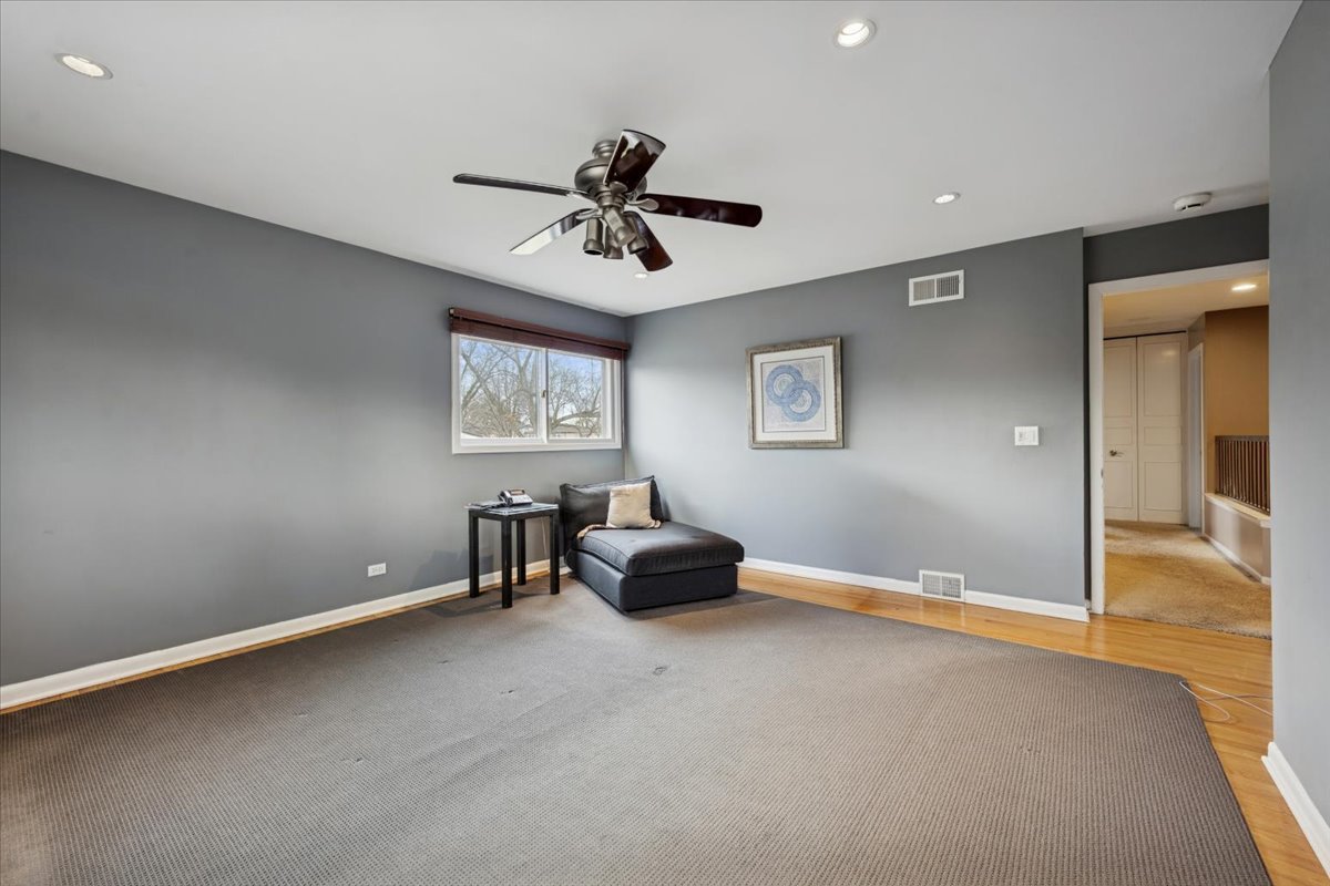 1908 McCraren Road Highland Park, IL 60035 - Photo 22 of 37 a living room with furniture and a ceiling fan