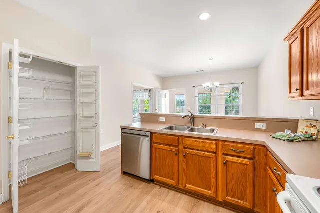 a kitchen with sink and cabinets